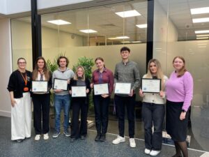 Graduates photo proudly holding their LMI certificates